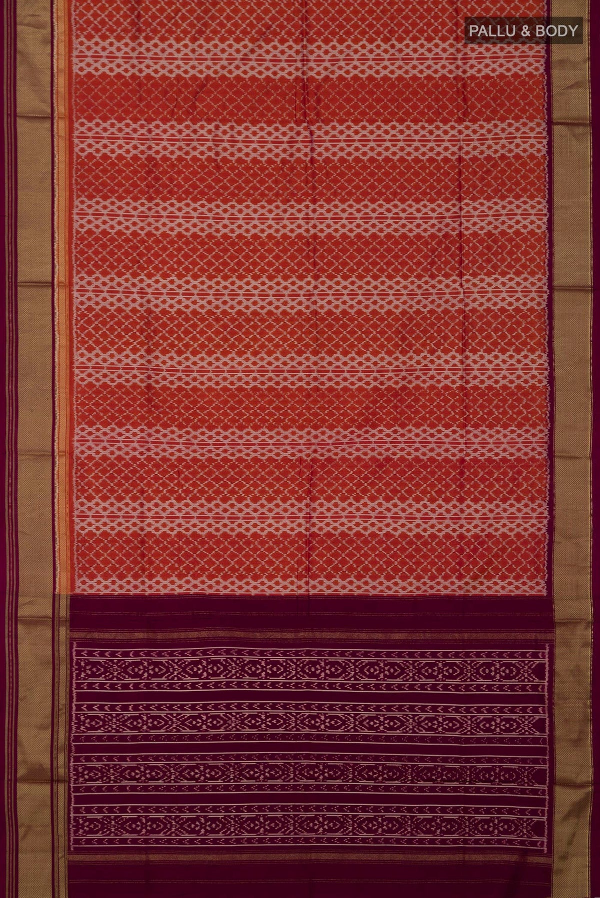 Flat view of Rust Pochampally Silk Saree with Ikat design on the body and Zari Border. 