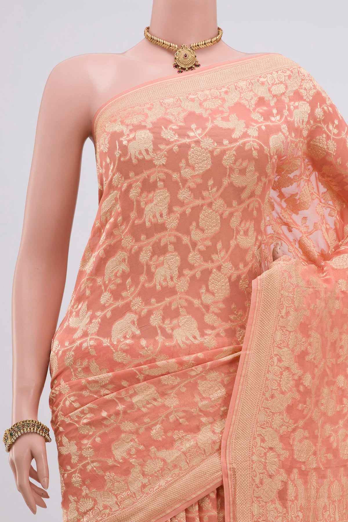 Border image of Peach Georgette Saree with Fancy on the body and Zari Border. 