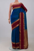 Blue Kanchipuram Saree with Plain Body and Zari Border.  displayed on a mannequin