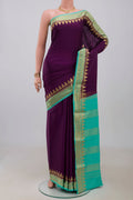 Purple Crepe Saree with Plain Body and Zari Border.  displayed on a mannequin