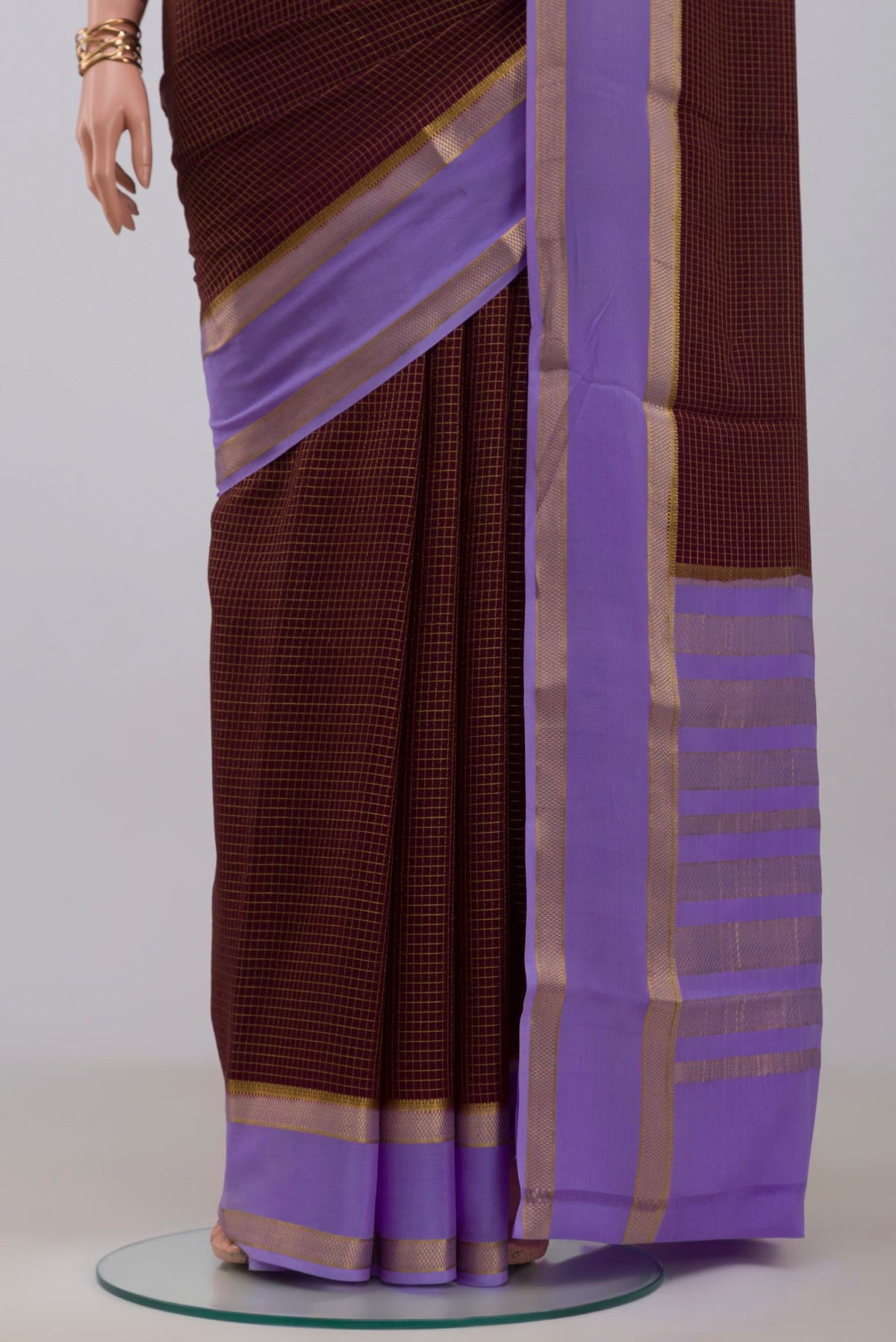 Pleats and pallu of Coffee Brown Mysore Crepe Saree with Checked design on the body and Zari Border. 