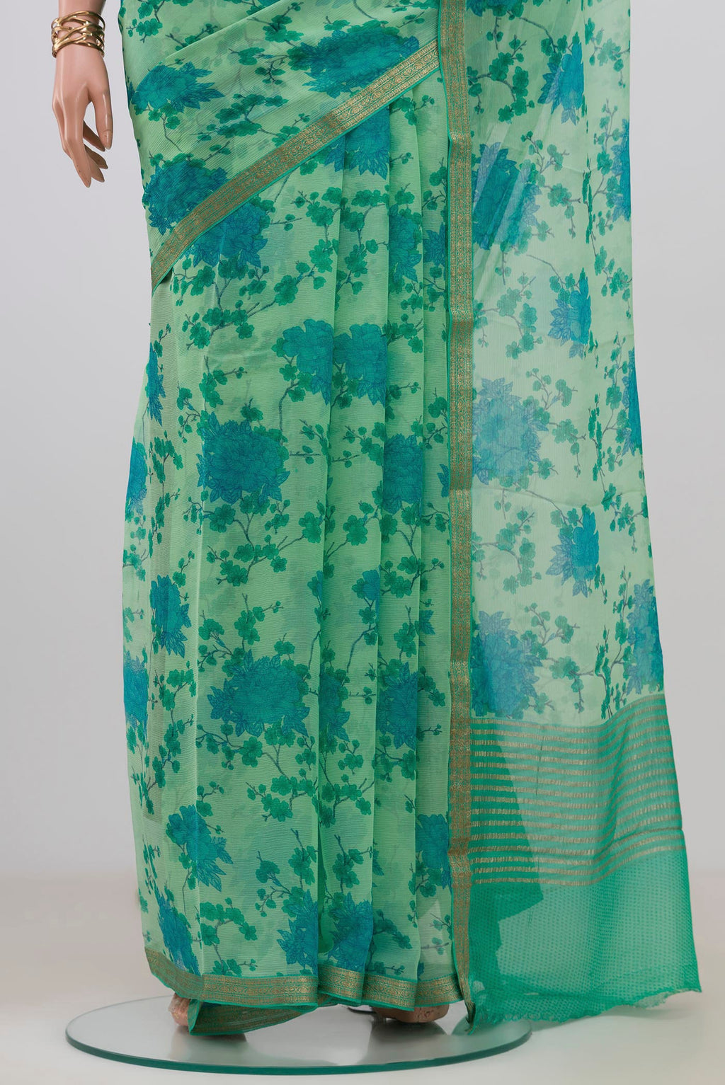 Pleats and pallu of Mint Green Mysore Chiffon Saree with Floral Print on the body and Zari Border. 