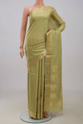 Beige Soft Silk Saree with Zari Butta on the body and Zari Border.  displayed on a mannequin