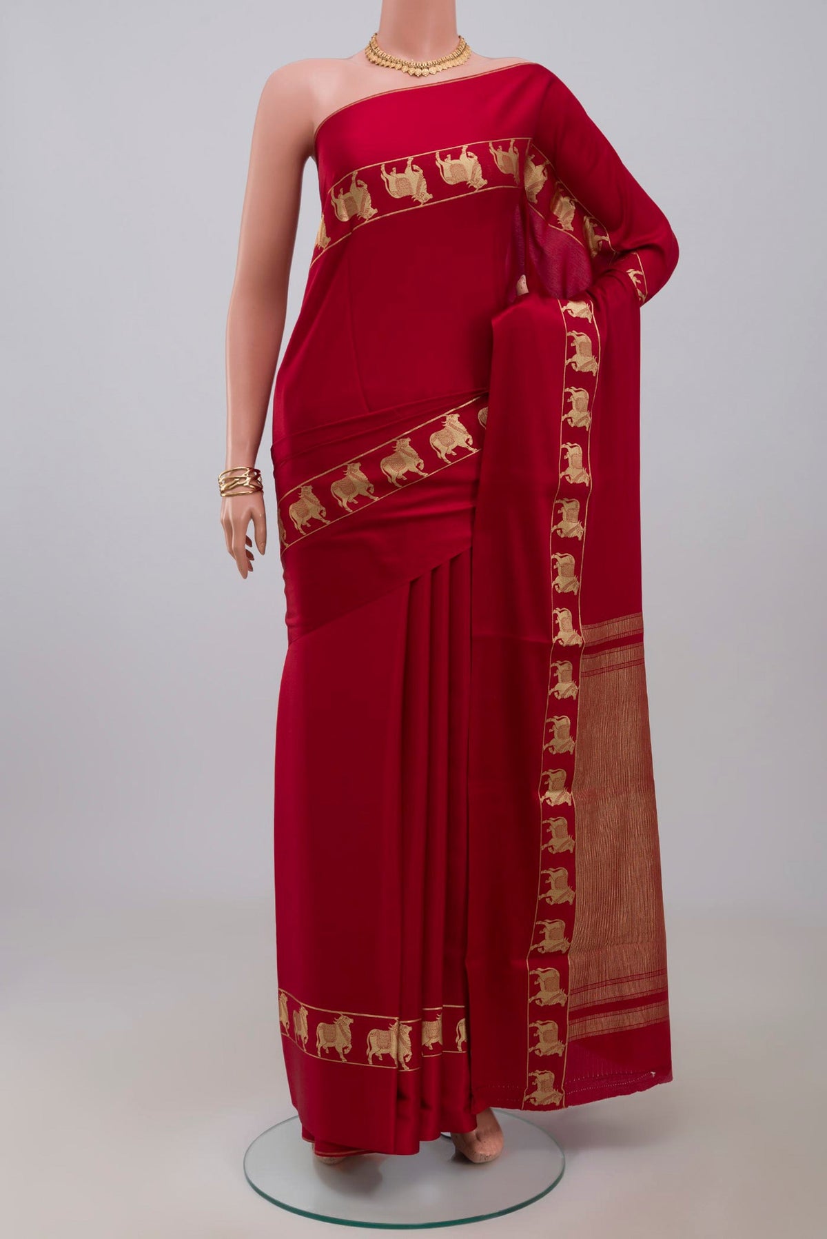 Red Mysore Crepe Saree with Plain Body and Zari Border.  displayed on a mannequin