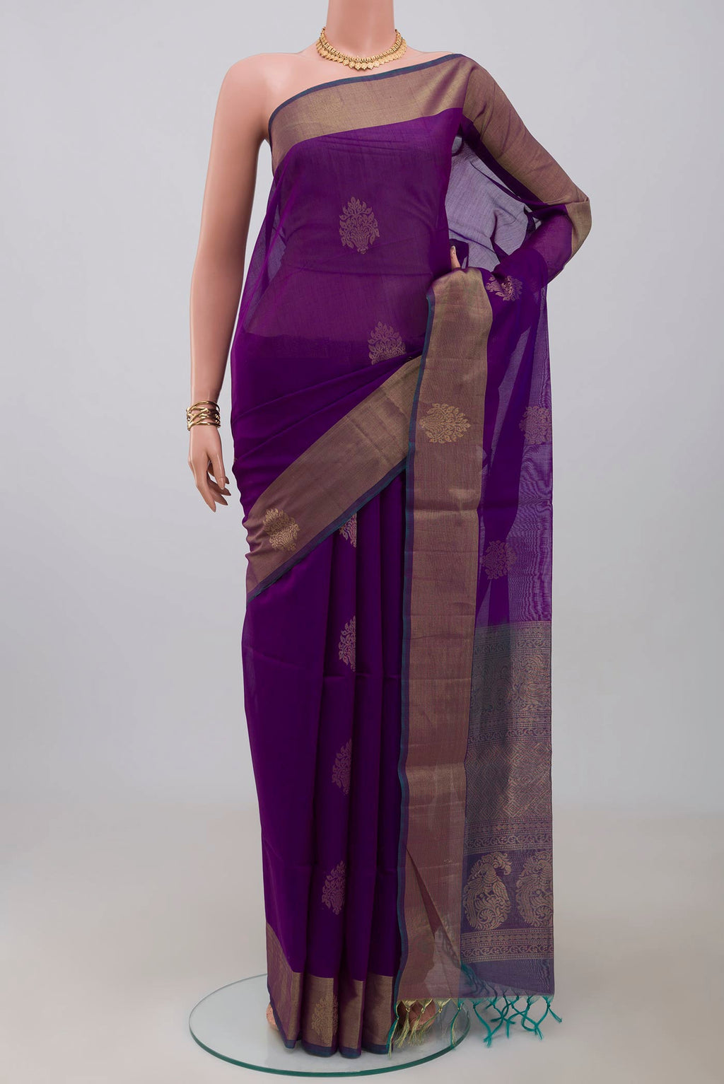 Purple Silk Cotton Saree with Zari Butta on the body and Zari Border.  displayed on a mannequin