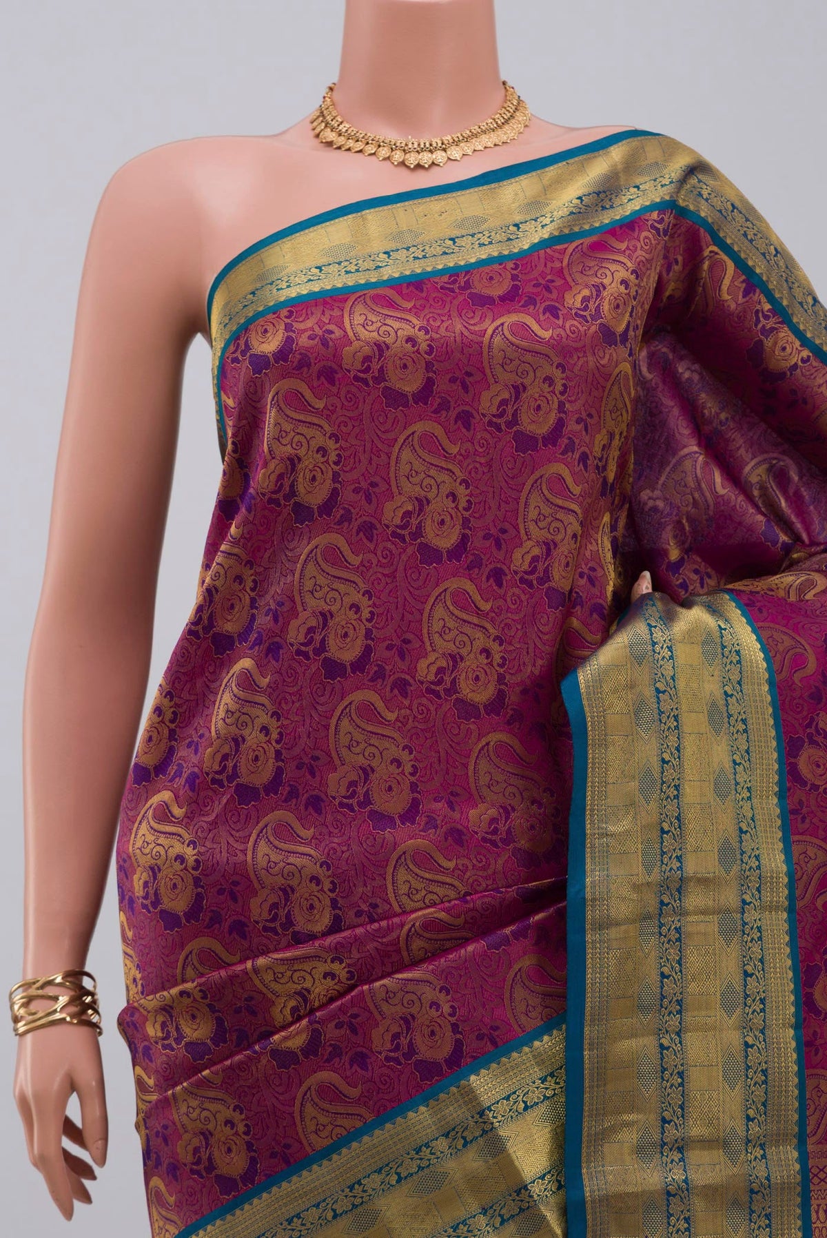 Border image of Purple Kanchipuram Saree with Zari Brocade on the body and Zari Border. 