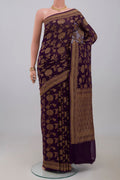 Purple Georgette Saree with Fancy on the body and Fancy Border.  displayed on a mannequin