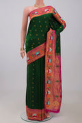 Green Gadwal Silk Saree with Zari Butta on the body and Paithani Border.  displayed on a mannequin