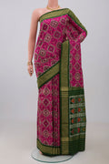 Pink Pochampally Saree with Ikat Print on the body and Zari Border.  displayed on a mannequin