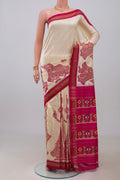 Off White Pochampally Silk Saree with Ikat design on the body and Zari Border.  displayed on a mannequin