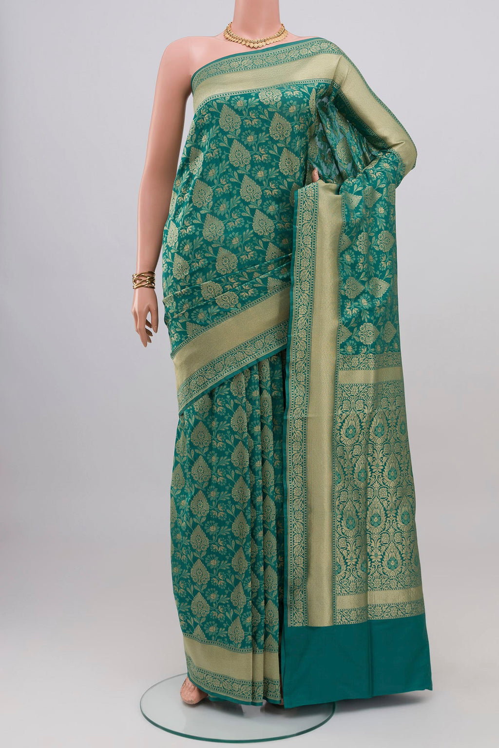 Turquoise Banarasi Silk Saree with Zari And Thread Butta on the body and Zari Border.  displayed on a mannequin