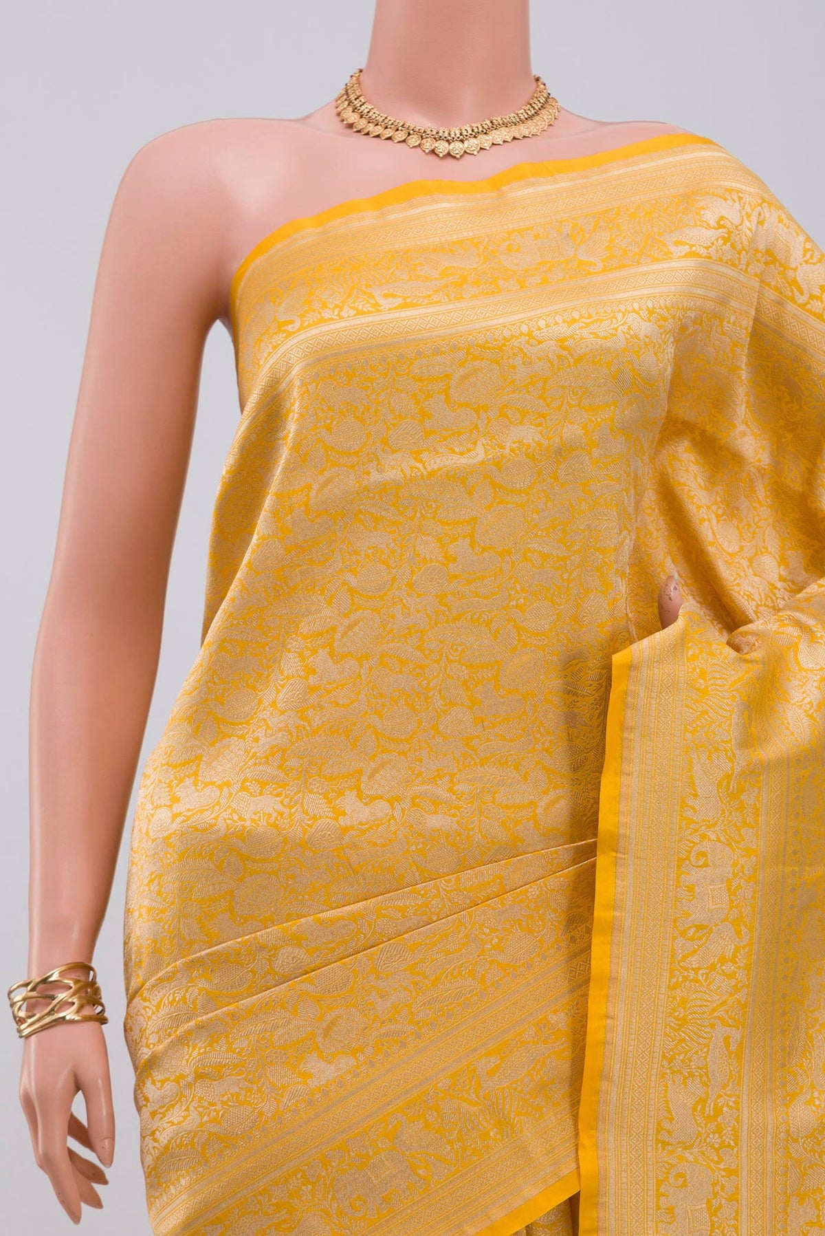 Border image of Yellow Banarasi Saree with Zari Brocade on the body and Fancy Border. 