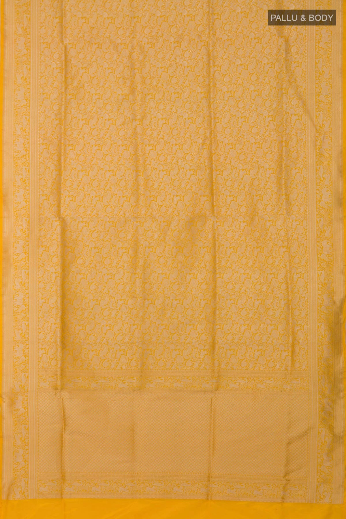 Flat view of Yellow Banarasi Saree with Zari Brocade on the body and Fancy Border. 