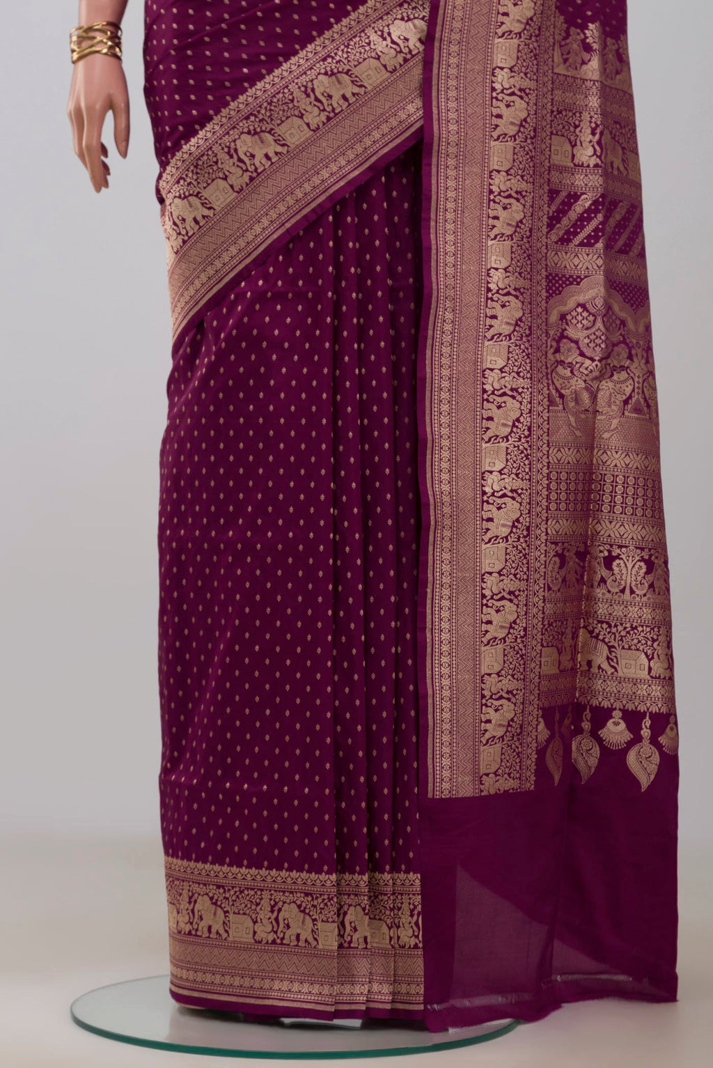 Pleats and pallu of Purple Banarasi Silk Saree with Zari Butta on the body and Zari Border. 