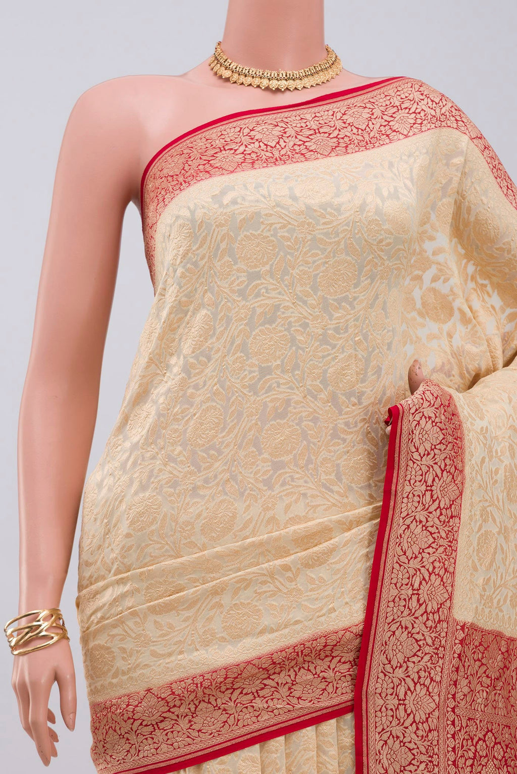 Border image of Cream Georgette Saree with Fancy on the body and Zari Border. 