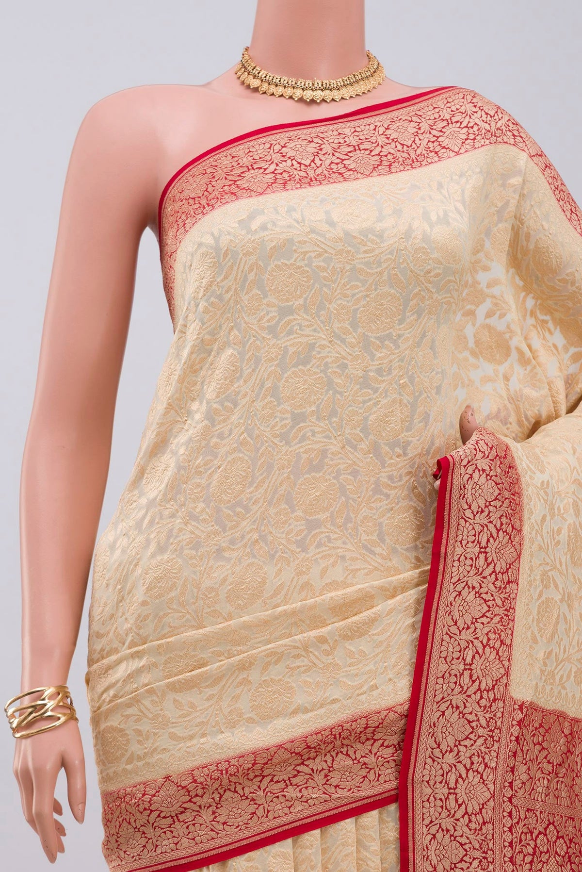 Border image of Cream Georgette Saree with Fancy on the body and Zari Border. 