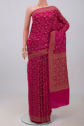 Pink Georgette Saree with Fancy on the body and Zari Border.  displayed on a mannequin