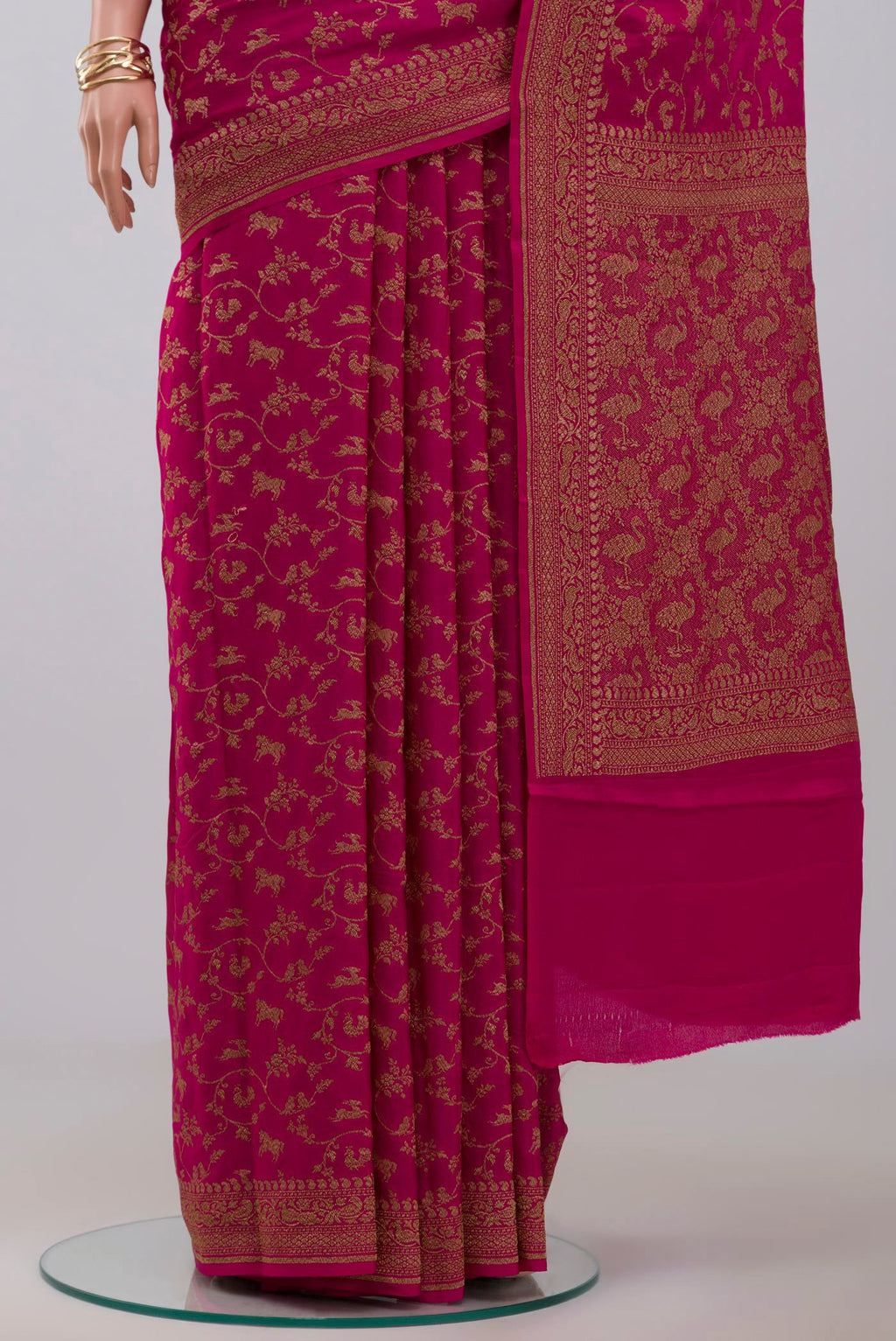 Pleats and pallu of Pink Georgette Saree with Fancy on the body and Zari Border. 