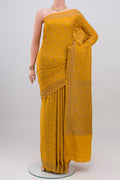 Yellow Banarasi Georgette Saree with Zari Butta on the body and Zari Border.  displayed on a mannequin