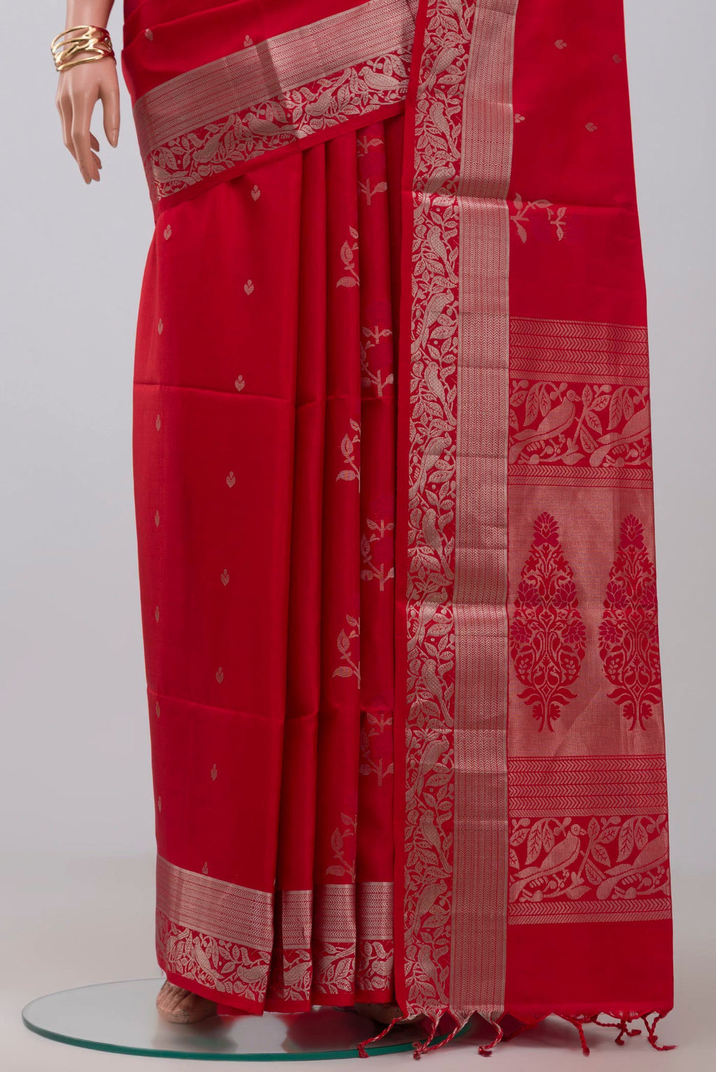 Pleats and pallu of Red Soft Silk Saree with Zari Butta on the body and Zari Border. 