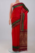 Red Soft Silk Saree with Zari Butta on the body and Fancy Border.  displayed on a mannequin