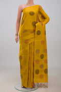 Yellow Soft Silk Saree with Thread Butta on the body and Without Border.  displayed on a mannequin