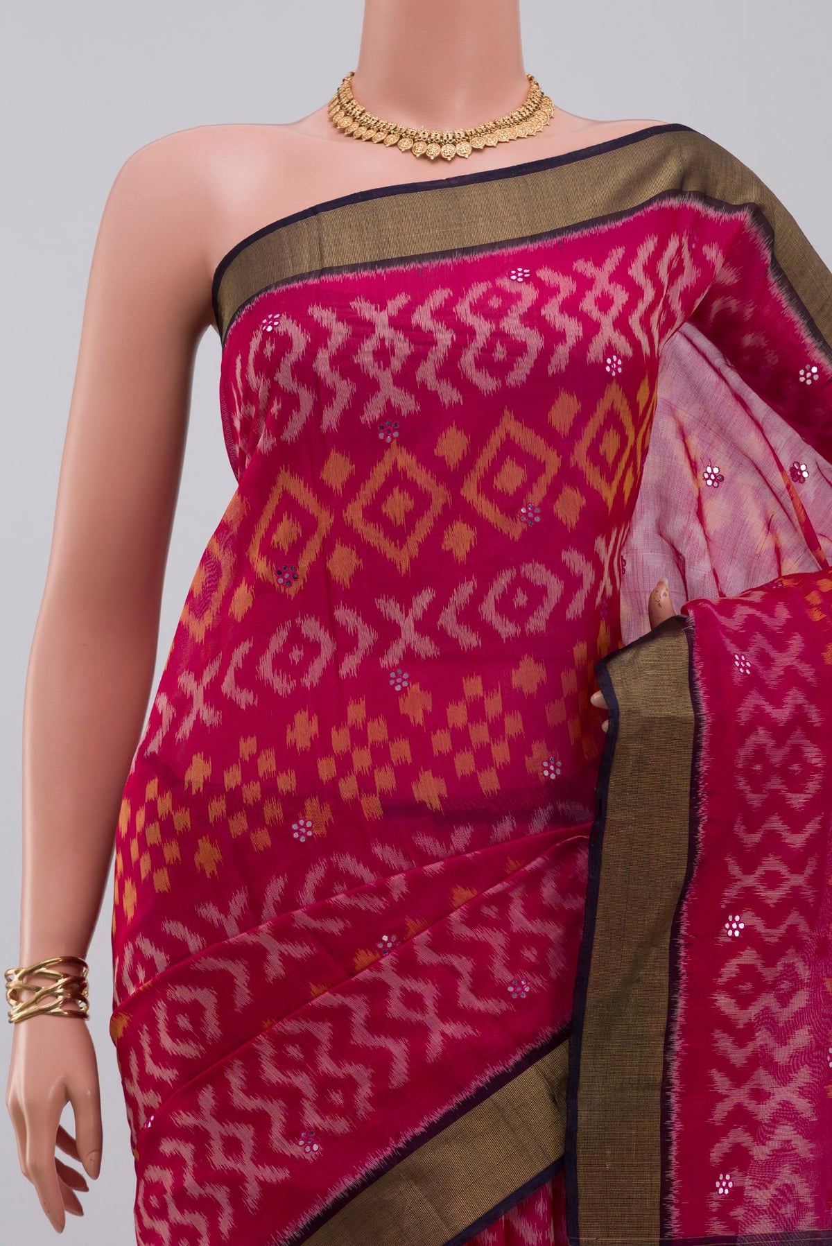 Border image of Pink Silk Cotton Saree with Ikat Print on the body and Zari Border. 