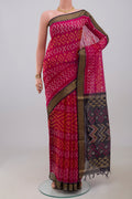 Pink Silk Cotton Saree with Ikat Print on the body and Zari Border.  displayed on a mannequin