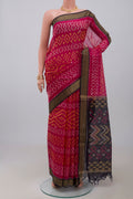 Pink Silk Cotton Saree with Ikat design on the body and Zari Border.  displayed on a mannequin