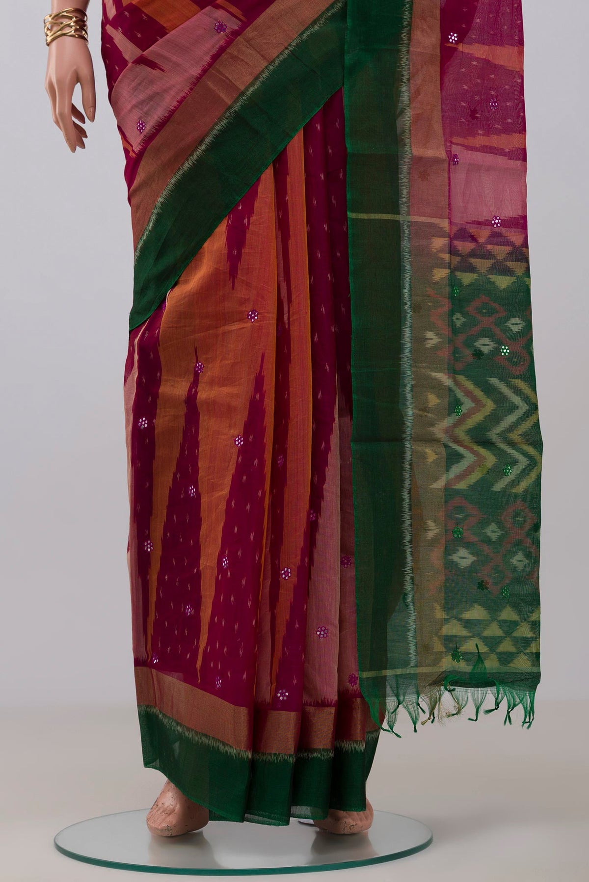 Pleats and pallu of Pink Silk Cotton Saree with Ikat Print on the body and Zari Border. 