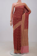 Maroon Banarasi Georgette Saree with Zari Brocade on the body and Zig Zag Border.  displayed on a mannequin
