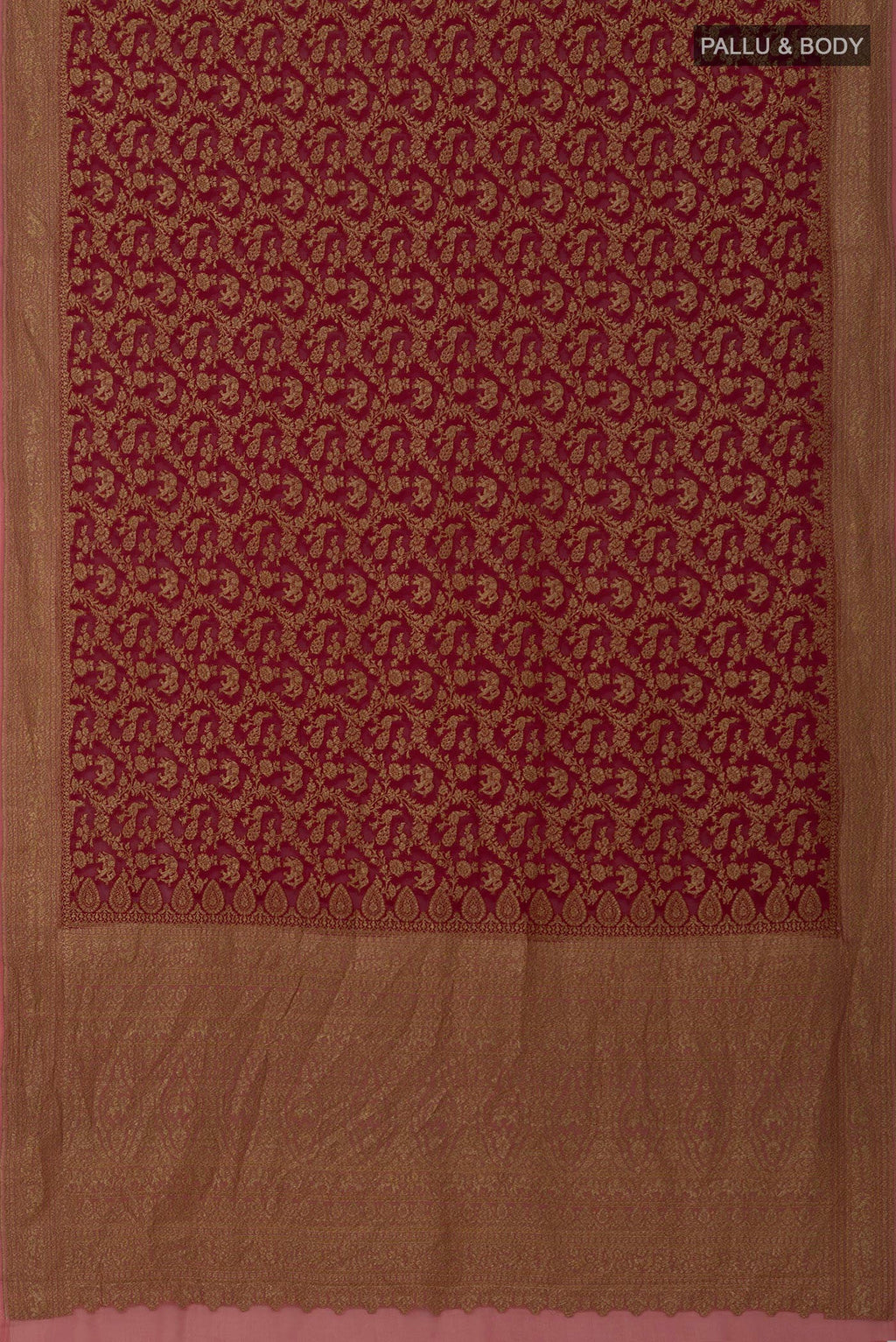 Flat view of Maroon Banarasi Georgette Saree with Zari Brocade on the body and Zig Zag Border. 