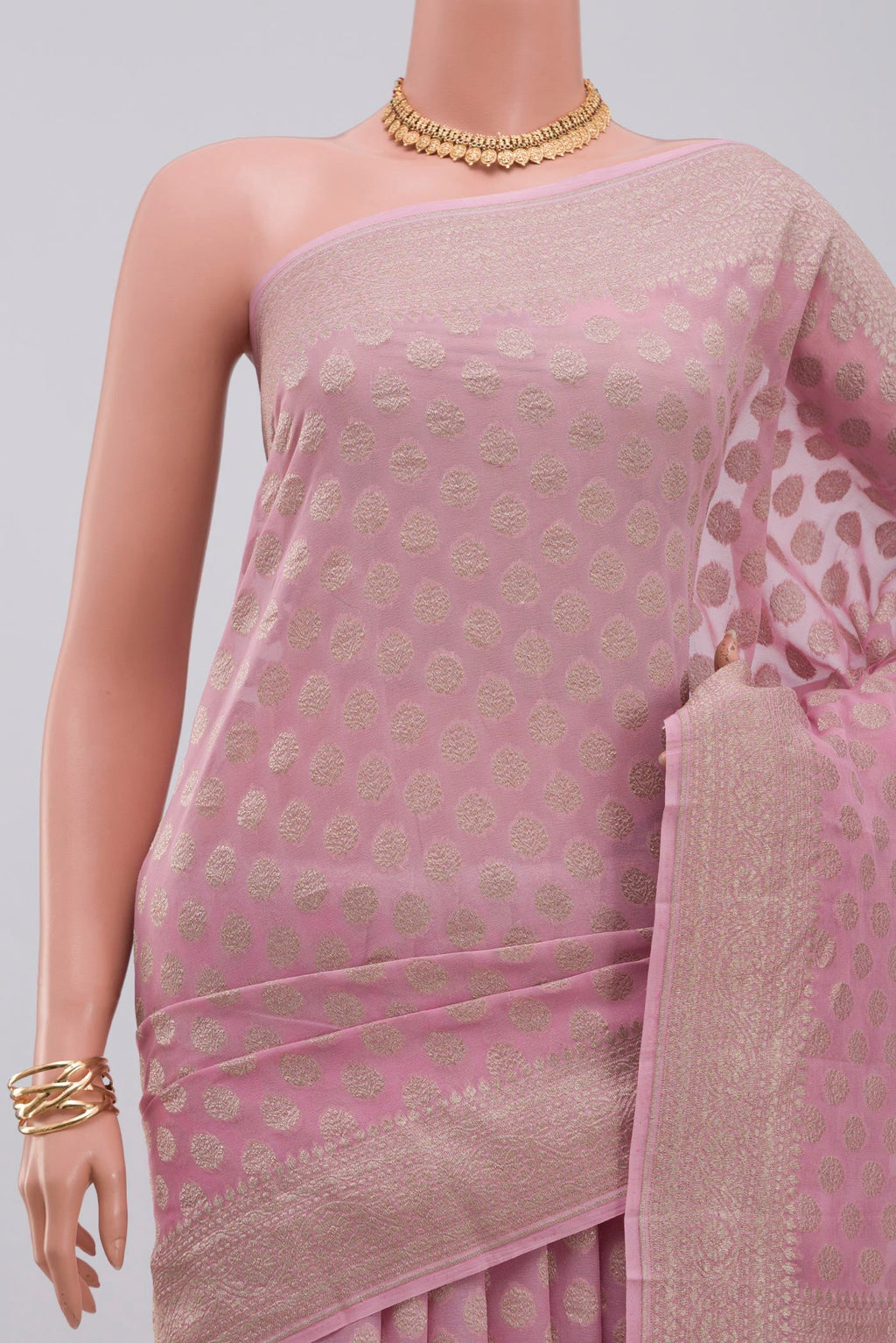 Border image of Pink Georgette Saree with Fancy on the body and Zari Border. 