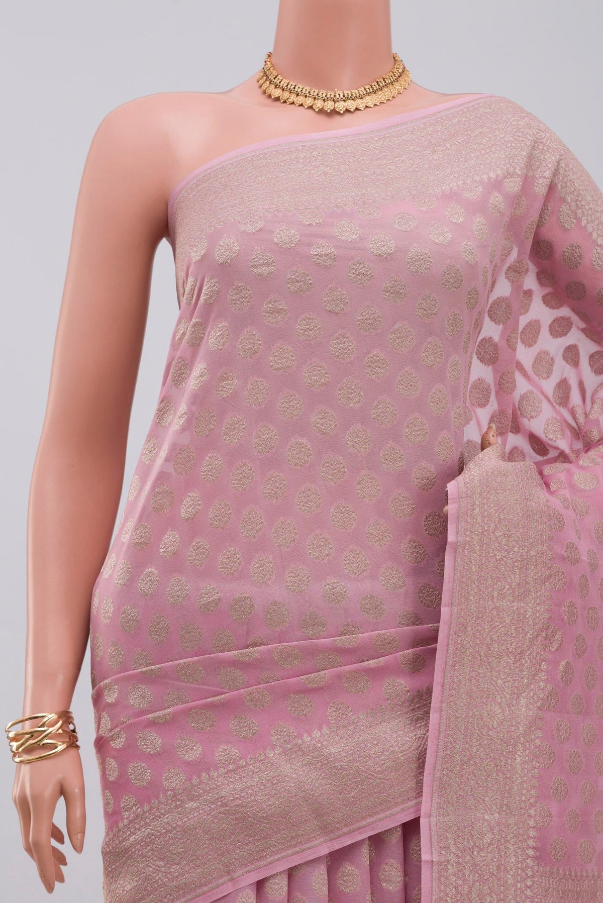 Border image of Pink Georgette Saree with Fancy on the body and Zari Border. 