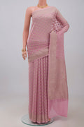 Pink Georgette Saree with Fancy on the body and Zari Border.  displayed on a mannequin
