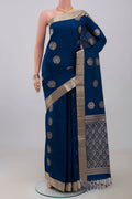Blue Soft Silk Saree with Zari Butta on the body and Zari Border.  displayed on a mannequin