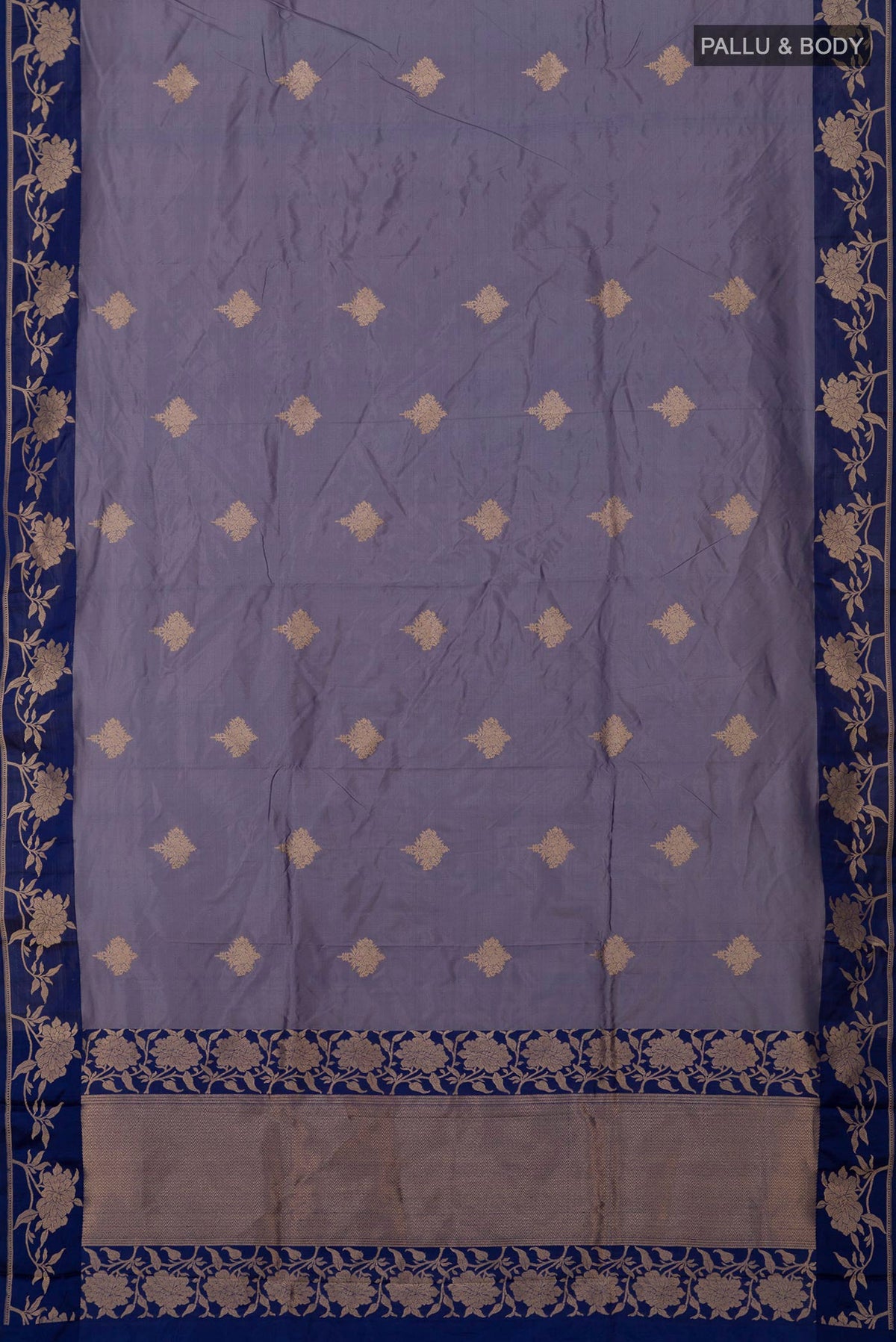 Flat view of Blue Grey Banarasi Katan Silk Saree with Zari Butta on the body and Fancy Border. 