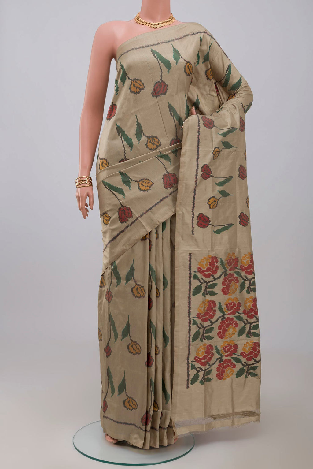 Beige Pochampally Silk Saree with Ikat design on the body and Without Border.  displayed on a mannequin