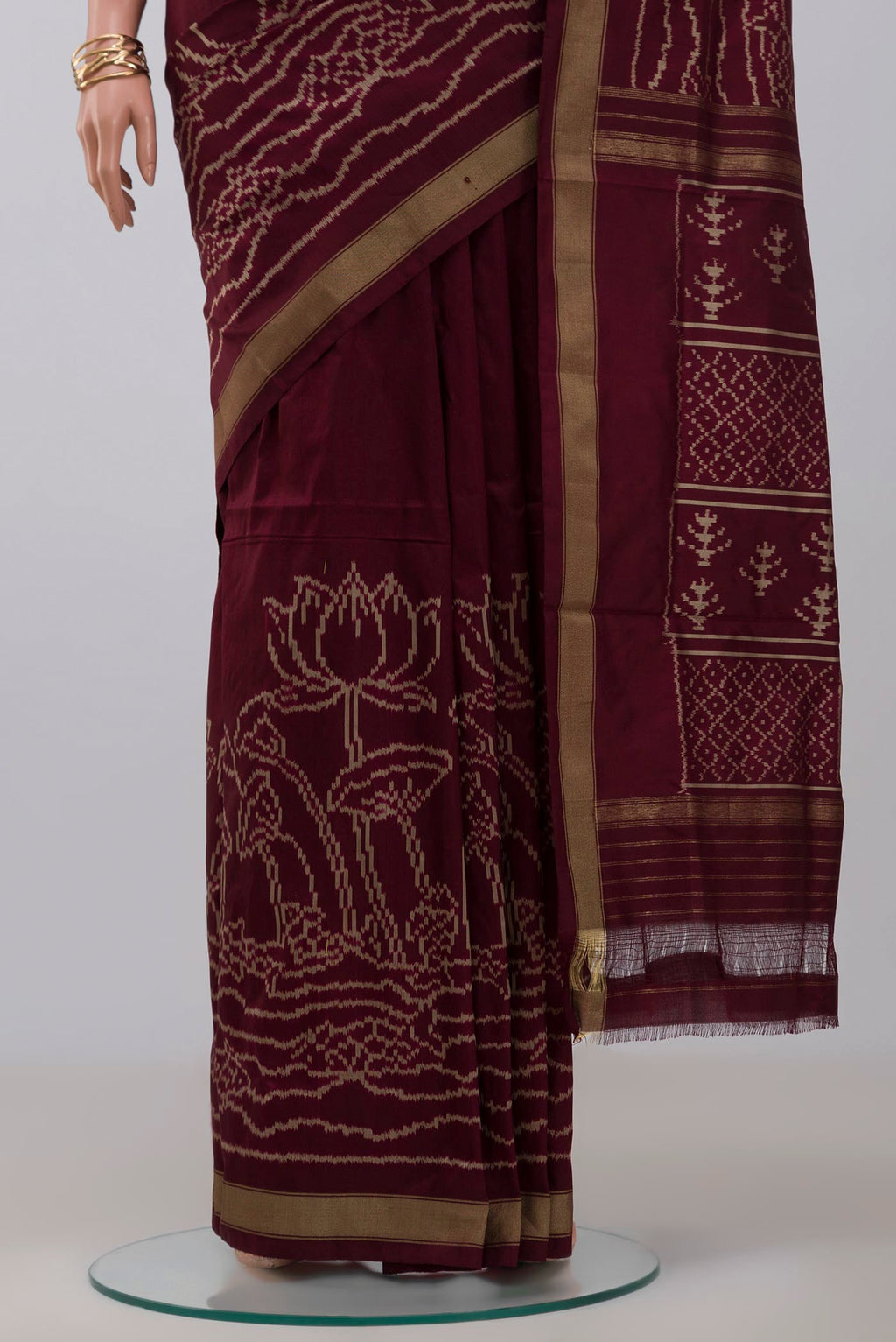Pleats and pallu of Brown Pochampally Silk Saree with Ikat design on the body and Zari Border. 