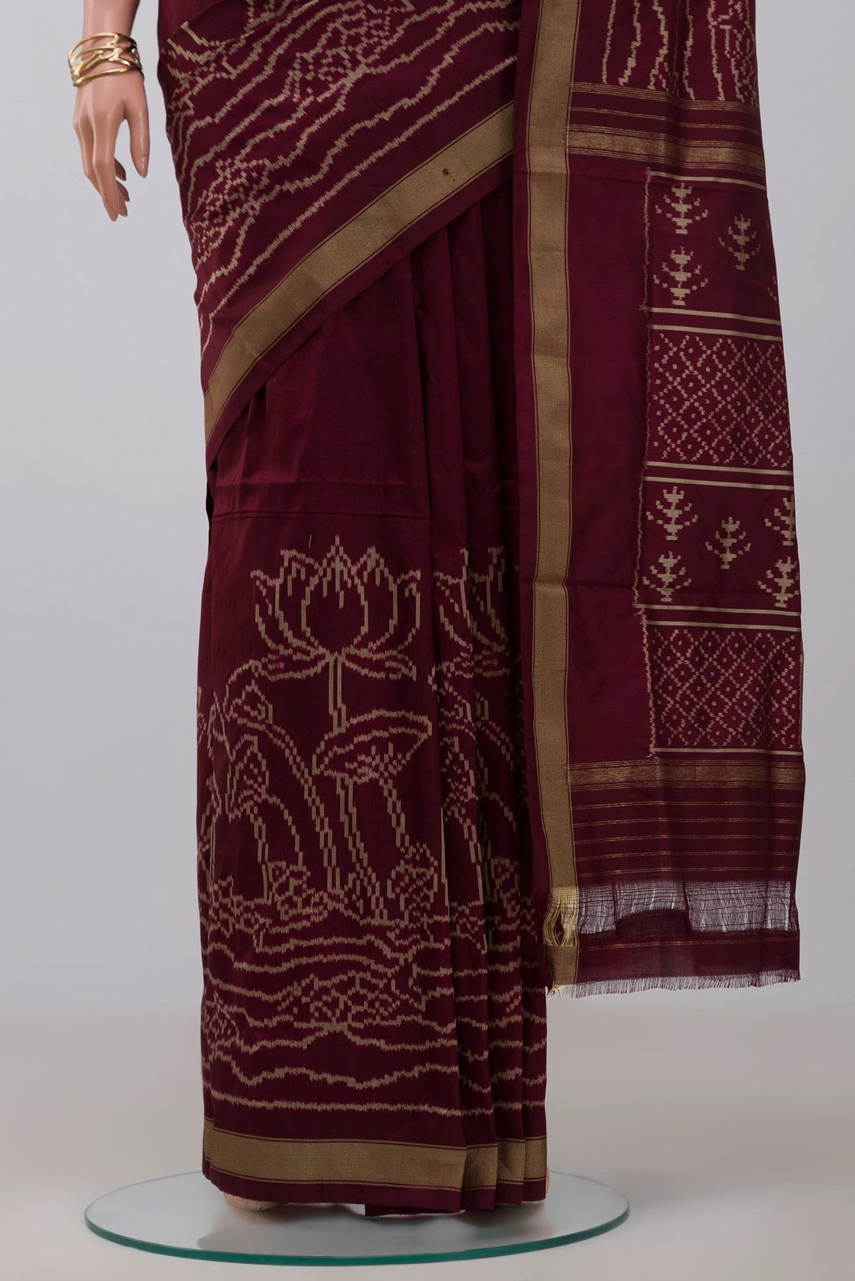 Pleats and pallu of Brown Pochampally Silk Saree with Ikat design on the body and Zari Border. 