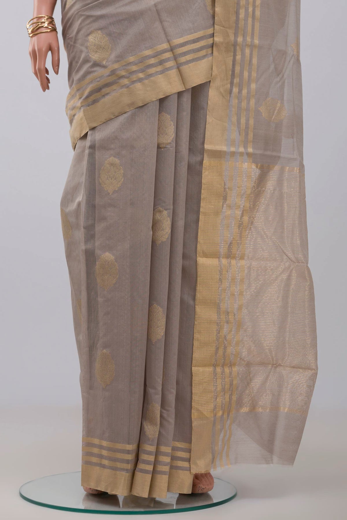 Pleats and pallu of Grey Chanderi Silk Cotton Saree with Zari Butta on the body and Zari Border. 