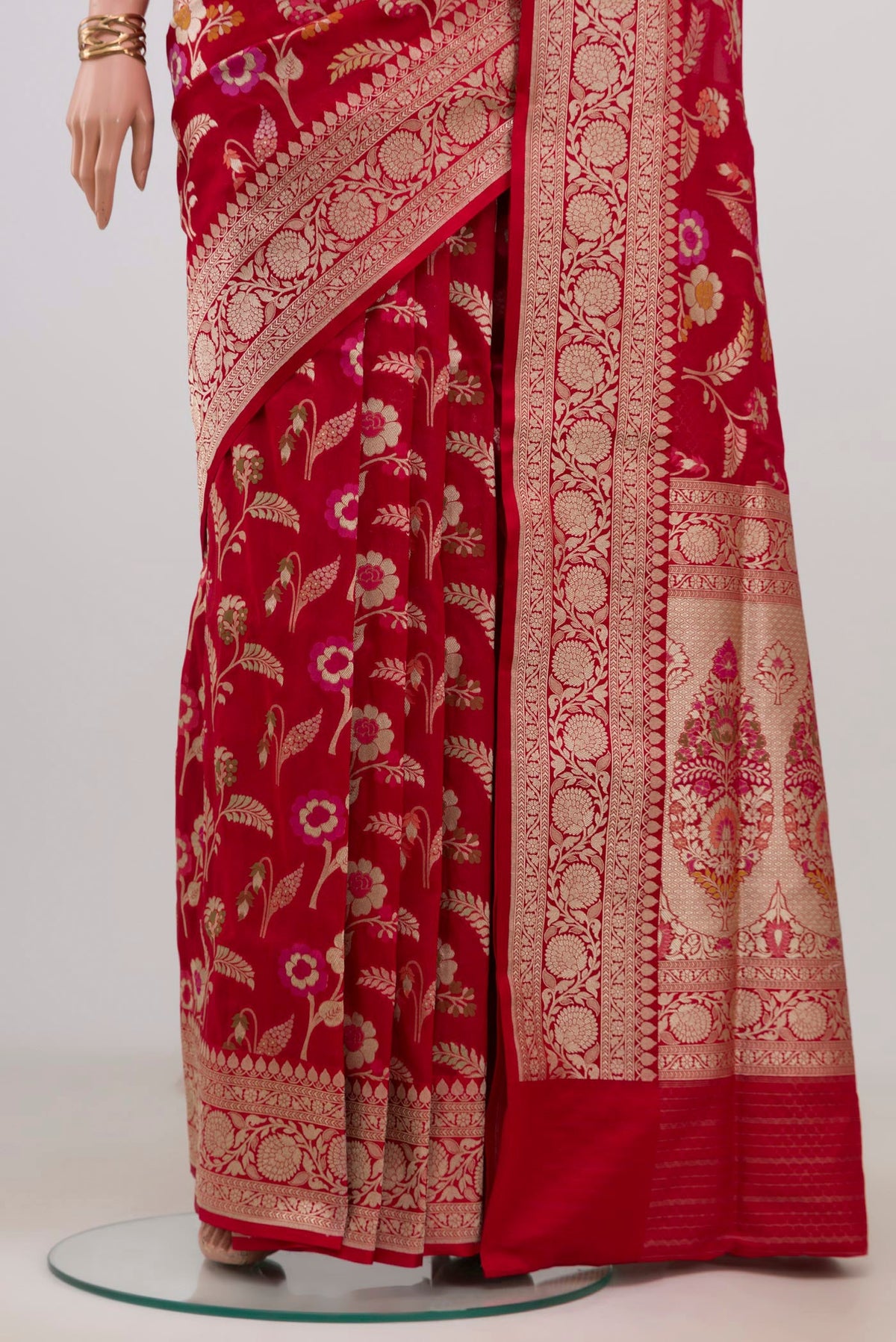 Pleats and pallu of Red Banarasi Silk Saree with Zari And Thread Butta on the body and Fancy Border. 