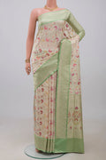 Cream Banarasi Silk Saree with Zari And Thread Butta on the body and Zari Border.  displayed on a mannequin