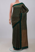 Bottle Green Mysore Crepe Saree with Zari Brocade on the body and Thin Zari Line.  displayed on a mannequin