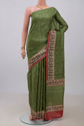 Green Printed Silk Saree with Printed design on the body and Printed Border.  displayed on a mannequin