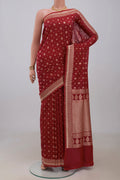 Maroon Banarasi Saree with Zari Butta on the body and Fancy Border.  displayed on a mannequin