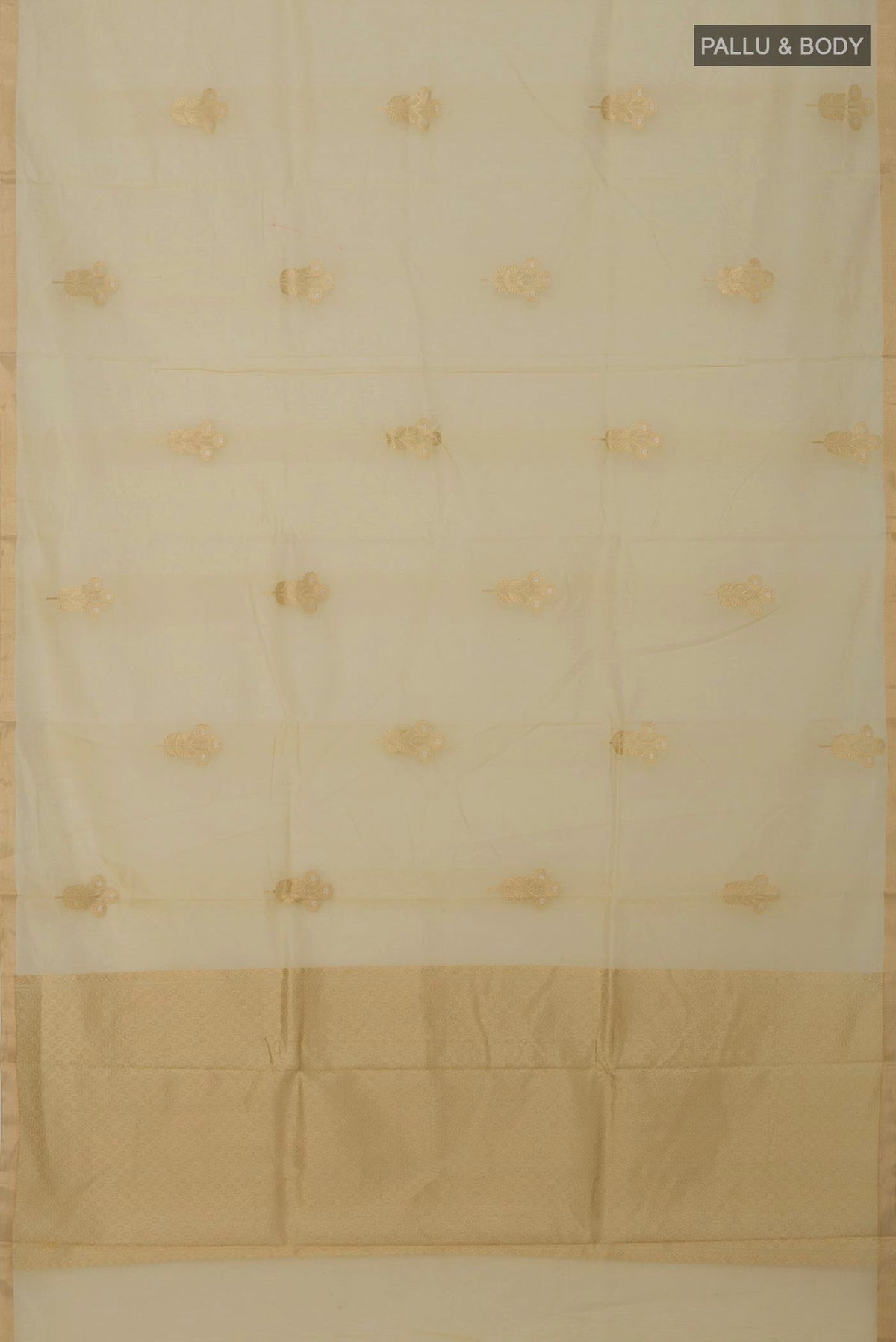 Flat view of Cream Banarasi Kora Cotton Saree with Zari Butta on the body and Zari Border. 