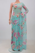 Blue Chiffon Saree with Printed design on the body and Without Border.  displayed on a mannequin