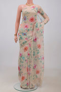 Beige Chiffon Saree with Printed design on the body and Without Border.  displayed on a mannequin