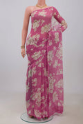 Pink Chiffon Saree with Printed design on the body and Without Border.  displayed on a mannequin